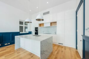 A beautiful, modern kitchen, in a home in the Holland Park area. This home park of Property Management in Holland Park by Quintessentially Estates